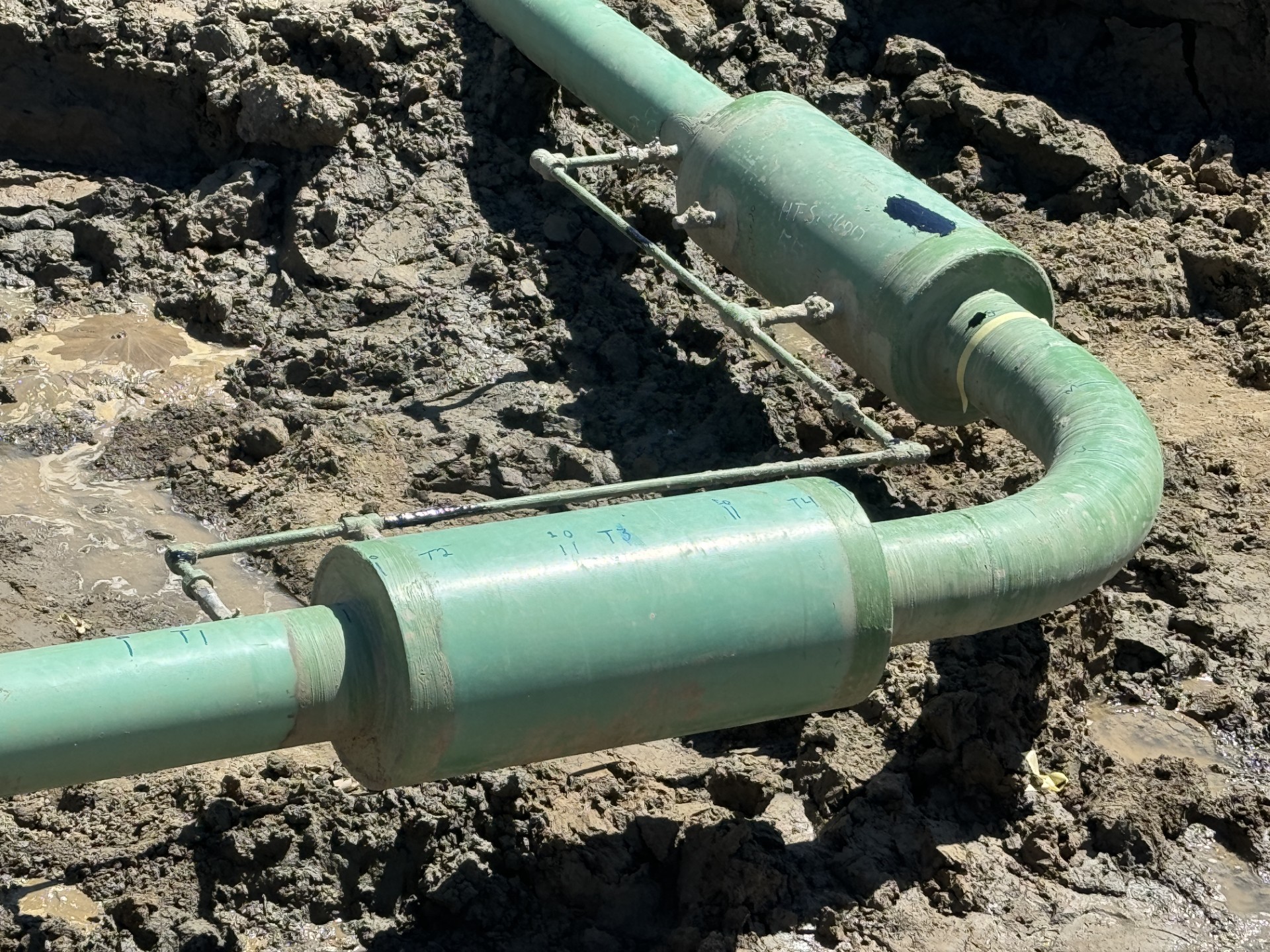 Pipeline Integrity Close up image of a pipe in the ground.